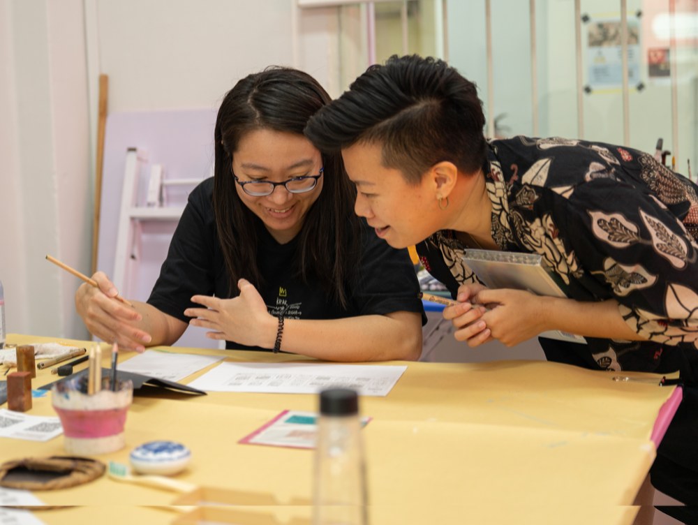 Michelle guiding a participant through the design process